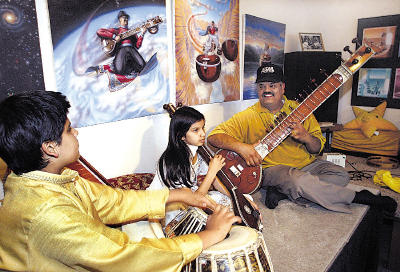 Just as his father did with him famed Santa Cruz sitar master