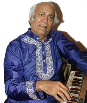 Picture of S. D. Batish playing the harmonium. Copyright 2003 Batish Institute.